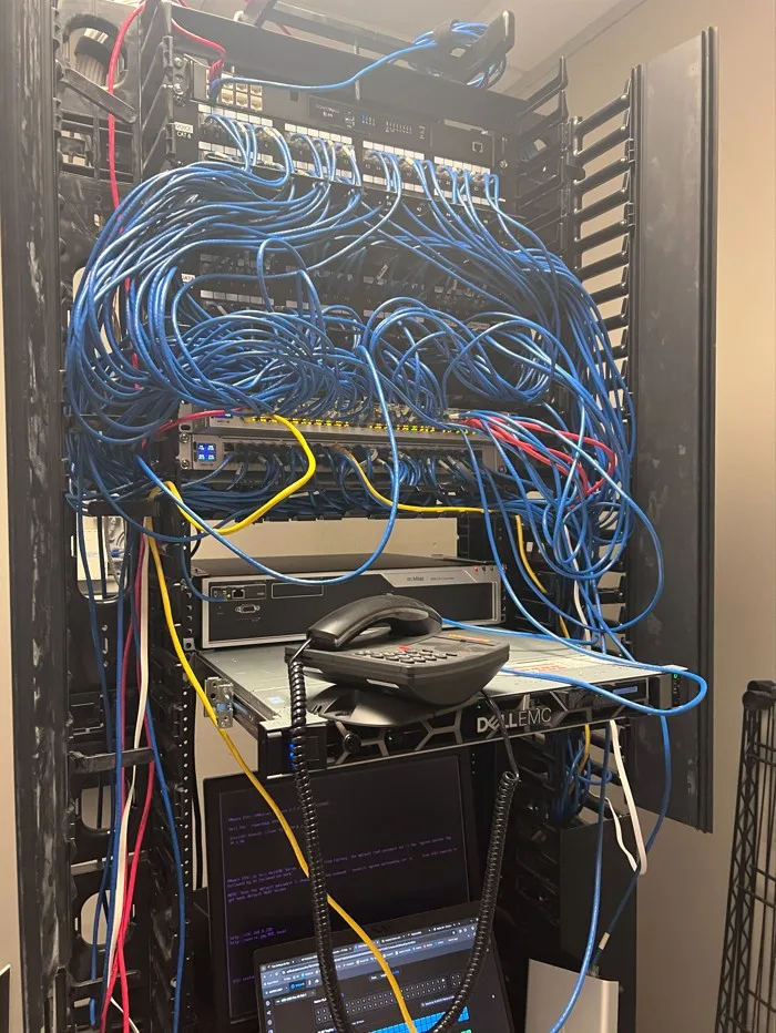 Network rack before cable cleanup